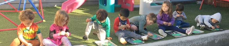 Happy children playing outside at Shining Star Schoolhouse